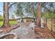 Picturesque backyard featuring a stone patio, fire pit, and lush landscaping at 5405 S Lowell Blvd, Littleton, CO 80123