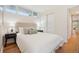 Bright bedroom featuring hardwood floors, neutral walls, a window, and a closet at 5405 S Lowell Blvd, Littleton, CO 80123