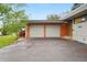 Attached garage with two doors and a spacious driveway at 5405 S Lowell Blvd, Littleton, CO 80123