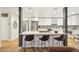 Well-appointed kitchen with an eat-in island, stainless steel appliances, and modern cabinetry, perfect for entertaining at 5405 S Lowell Blvd, Littleton, CO 80123