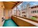 Balcony with views of building exterior including wood and stone masonry at 4671 S Decatur St # 232, Englewood, CO 80110