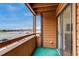 Private balcony with water view and parking area, accessible through sliding glass door at 4671 S Decatur St # 232, Englewood, CO 80110