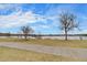 Scenic view of a tranquil lake bordered by trees and greenery under a bright sky at 4671 S Decatur St # 232, Englewood, CO 80110