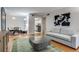Bright living room featuring an open floor plan with hardwood floors and modern decor at 4671 S Decatur St # 232, Englewood, CO 80110