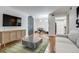 Stylish living room featuring a TV, a modern console table and a stylish rug at 4671 S Decatur St # 232, Englewood, CO 80110