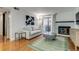 Cozy living room with a fireplace and sliding glass doors to a balcony or patio space at 4671 S Decatur St # 232, Englewood, CO 80110