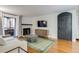 Bright living room with a fireplace, large windows, and access to an outdoor area at 4671 S Decatur St # 232, Englewood, CO 80110