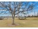 Tranquil park featuring a large tree, grassy field and a picnic gazebo at 4671 S Decatur St # 232, Englewood, CO 80110