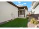 Low-maintenance backyard featuring artificial turf and a cozy patio area at 20968 E 60Th Pl, Aurora, CO 80019