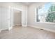 Bright bonus room with hardwood floors, large windows, and double french doors at 20968 E 60Th Pl, Aurora, CO 80019