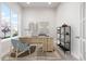 Cozy home office with a large window, stylish decor, and comfortable workspace at 20968 E 60Th Pl, Aurora, CO 80019