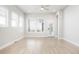 Bright living room features sleek hardwood floors, modern lighting, and a large window at 20968 E 60Th Pl, Aurora, CO 80019