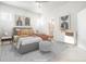 Stylishly staged main bedroom features a comfortable bed, ample natural light, and modern decor at 20968 E 60Th Pl, Aurora, CO 80019