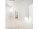 Large main bedroom featuring neutral carpet, large windows, and an ensuite bathroom at 20968 E 60Th Pl, Aurora, CO 80019