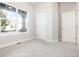 Bright bedroom with plush carpeting, large window, and neutral-toned walls at 20968 E 60Th Pl, Aurora, CO 80019