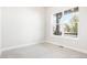 Well-lit bedroom featuring soft carpet, a large window with a view, and neutral walls at 20968 E 60Th Pl, Aurora, CO 80019