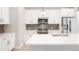 Modern kitchen with white cabinets, stainless steel appliances, and sleek countertops at 20968 E 60Th Pl, Aurora, CO 80019