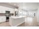 Modern kitchen features white cabinetry, stainless steel appliances, and a spacious island at 20968 E 60Th Pl, Aurora, CO 80019