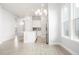 Open concept kitchen with white cabinets, stainless steel appliances, and an island at 20968 E 60Th Pl, Aurora, CO 80019