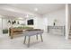 Finished basement rec room with a bar and games at 20968 E 60Th Pl, Aurora, CO 80019