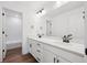 Bright bathroom featuring a double vanity with modern fixtures at 7016 E 126Th Pl, Thornton, CO 80602