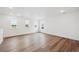 Bright bedroom with three windows and wood-look flooring for a modern look at 7016 E 126Th Pl, Thornton, CO 80602