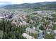 Scenic aerial view of the community surrounded by a lush forest and a beautiful river at 805 Columbine Rd # 105, Breckenridge, CO 80424