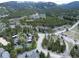 A beautiful aerial view of the community surrounded by nature and mature trees with mountain views at 805 Columbine Rd # 105, Breckenridge, CO 80424