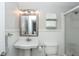 Bathroom features clean white fixtures, a shower, and a vanity mirror, providing a fresh and functional space at 805 Columbine Rd # 105, Breckenridge, CO 80424