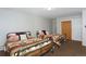 Bedroom features twin beds with patterned blankets, decorative pillows, and a closet for ample storage at 805 Columbine Rd # 105, Breckenridge, CO 80424