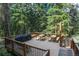 Spacious wooden deck with multiple picnic tables and BBQ perfect for outdoor gatherings at 805 Columbine Rd # 105, Breckenridge, CO 80424