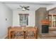 Dining area features a table, chairs, window view, and fireplace, enhancing the room's warm and inviting atmosphere at 805 Columbine Rd # 105, Breckenridge, CO 80424