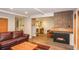 Spacious living room with hardwood floors, fireplace, and a peek into the adjacent kitchen at 805 Columbine Rd # 105, Breckenridge, CO 80424
