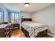 Cozy bedroom with hardwood floors and built-in shelving at 24589 E Louisiana Cir, Aurora, CO 80018