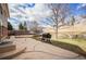 Spacious backyard with a fenced yard, a trampoline, a barbeque, and a large patio at 11073 Newland St, Westminster, CO 80020