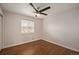 Bedroom featuring hardwood flooring, a window, and a ceiling fan at 11073 Newland St, Westminster, CO 80020