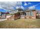 Charming two-story home with brick accents, blue shutters, landscaped lawn, and driveway at 11073 Newland St, Westminster, CO 80020