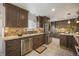 Well-equipped kitchen with stainless steel appliances and beautiful backsplash at 11073 Newland St, Westminster, CO 80020