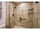 Shower stall with a glass door and tan tiled surround at 11073 Newland St, Westminster, CO 80020