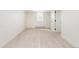 Finished basement space with light wood flooring, offering a versatile and open layout at 7453 E Jefferson Dr, Denver, CO 80237