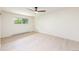 A bright bedroom with a modern ceiling fan and light-colored hardwood flooring at 7453 E Jefferson Dr, Denver, CO 80237
