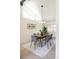 Chic dining area featuring modern lighting, sleek furniture, and a serene ambiance at 7453 E Jefferson Dr, Denver, CO 80237