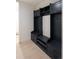 Entryway with custom built-in mudroom storage featuring shelves, drawers, and coat hooks at 7453 E Jefferson Dr, Denver, CO 80237