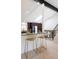 Modern kitchen with granite countertops, stainless steel appliances, and bar stool seating at 7453 E Jefferson Dr, Denver, CO 80237