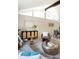 Inviting living room enhanced by neutral decor, artful furnishings and light wood floors at 7453 E Jefferson Dr, Denver, CO 80237