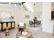 Bright living room featuring clerestory windows, eye-catching decor and warm wood floors at 7453 E Jefferson Dr, Denver, CO 80237