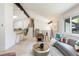 Open concept living room with clerestory windows, breakfast bar, and access to the staircase at 7453 E Jefferson Dr, Denver, CO 80237