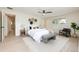 Bright, stylish main bedroom with modern decor, hardwood floors, and ample natural light at 7453 E Jefferson Dr, Denver, CO 80237