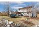 Large backyard with a pergola-covered patio, mature landscaping, and privacy fencing at 11936 W Temple Dr, Morrison, CO 80465