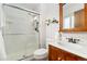 Bathroom featuring an updated stand-up shower, vanity, and modern fixtures and decor at 11936 W Temple Dr, Morrison, CO 80465